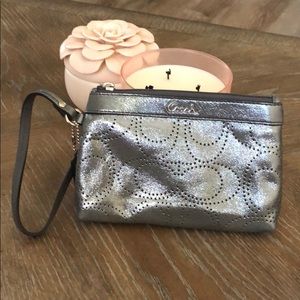 Beautiful shiny silver coach wristlet. New no tags